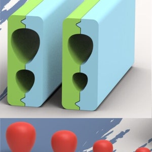 Puede incluir: Dos moldes de plástico verde y azul con tres moldes de silicona roja en forma de lágrima de diferentes tamaños.