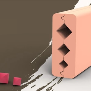 May include: A light peach-coloured rectangular block with three diamond-shaped cutouts. The block has a vertical groove. Three small, red, pyramid-shaped objects are in the lower left corner. The background is a gradient of brown and white.