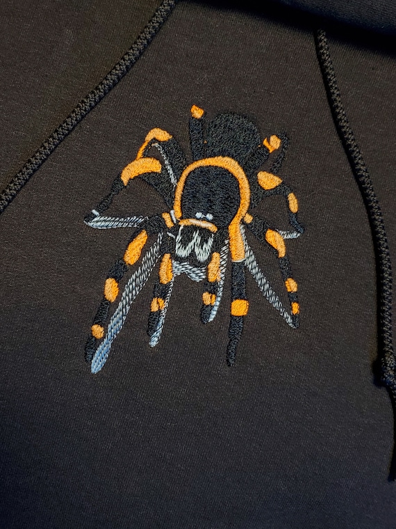 Brown hoodie with embroidered tarantula glow in the dark fluorescent design