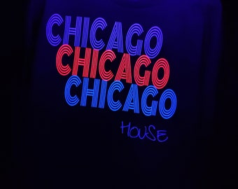 Chicago house music t-shirt with fluorescent and glow in the dark wording. Highlights under UV LIGHT and charges under UV light Sources.