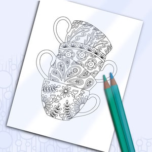 May include: A black and white line drawing of three stacked teacups with intricate floral designs. The teacups are on a white background with two blue pencils.