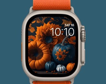 Apple watch wallpaper with pumpkins and flowers . Orange, black, and white pumpkins along with orange flowers to make a fall arrangement.