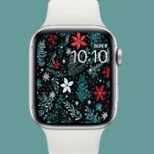 Könnte beinhalten: Eine weiße Apple Watch mit schwarzem Zifferblatt und einem festlichen Zifferblatt mit roten und grünen Blumenmustern. Das Zifferblatt zeigt Datum und Uhrzeit an: "SUN 8 10:10".