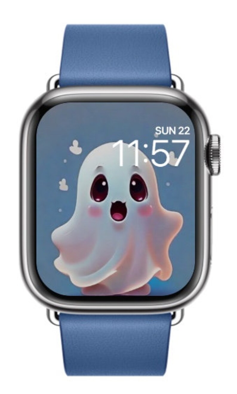 May include: A blue leather band Apple Watch with a white ghost cartoon on the screen. The time is 11:57 and the date is SUN 22.