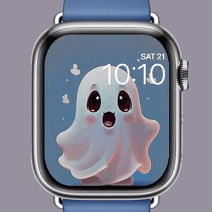 May include: A blue Apple Watch with a white ghost cartoon on the screen. The time is 10:10 and the date is SAT 21.