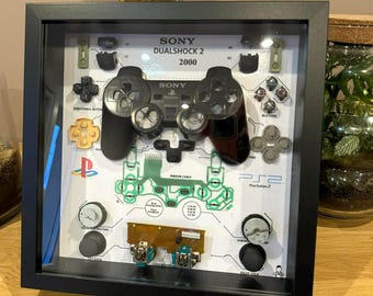 Black PlayStation 2 controller diorama frame