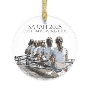 May include: Clear, round ornament with a watercolor illustration of a rowing team. The team is in a boat, with the text "SARAH 2025 CUSTOM ROWING CLUB" at the top. A gold ribbon is attached for hanging.