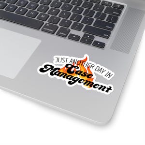 May include: A white sticker with black text that reads "Just another day in Case Management". The text is in a retro font and is set on fire.