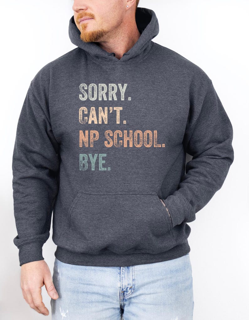 May include: A dark heather grey hoodie with a vintage-style graphic that reads "Sorry. Can't. NP School. Bye."