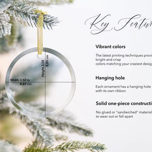 May include: A clear round glass ornament with a hanging hole and ribbon. The ornament measures 3.5 inches in diameter. Key Features: Vibrant colors, Hanging hole, Solid one-piece construction.