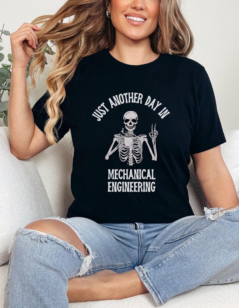 May include: Black t-shirt with a white skeleton graphic and the text "Just another day in mechanical engineering".