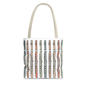May include: A white tote bag with a colorful pattern of flutes. The flutes are arranged vertically and are in various shades of pink, orange, blue, and green.