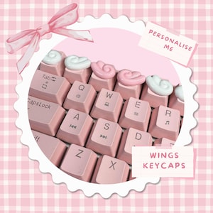 Tecla artesanal con alas de ángel kawaii: accesorio de teclado personalizado