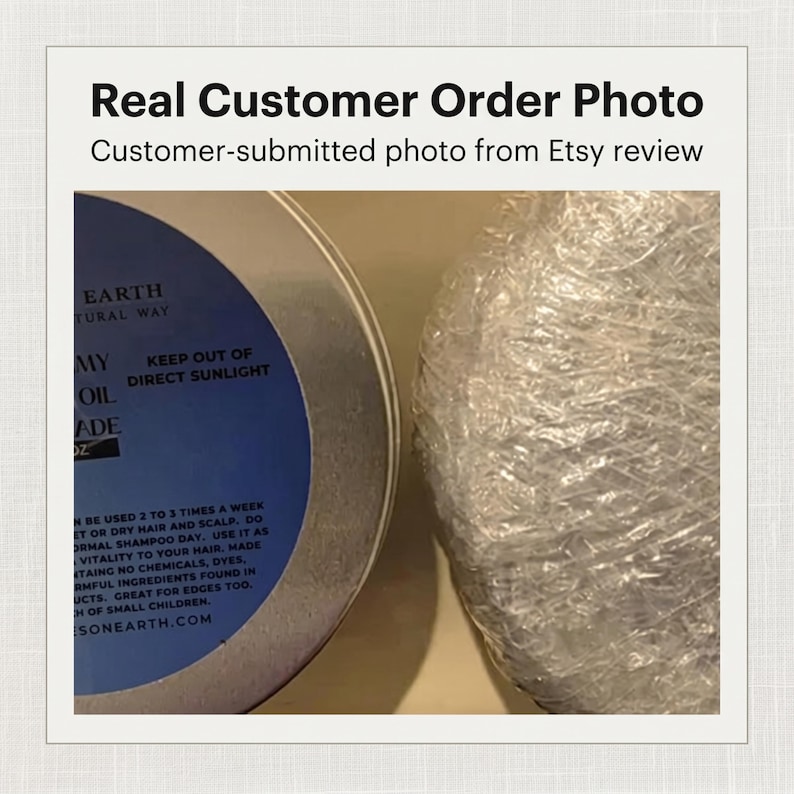 May include: A round metal container with a blue label featuring the text KEEP OUT OF DIRECT SUNLIGHT and instructions for hair and scalp use, positioned next to a second round item wrapped in clear, crinkled plastic protective packaging.
