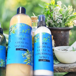 May include: Four blue and white bottles of hair care products with the text "Hair Growth" on each bottle. The bottles are arranged on a wooden surface with a mortar and pestle and green plants in the background.