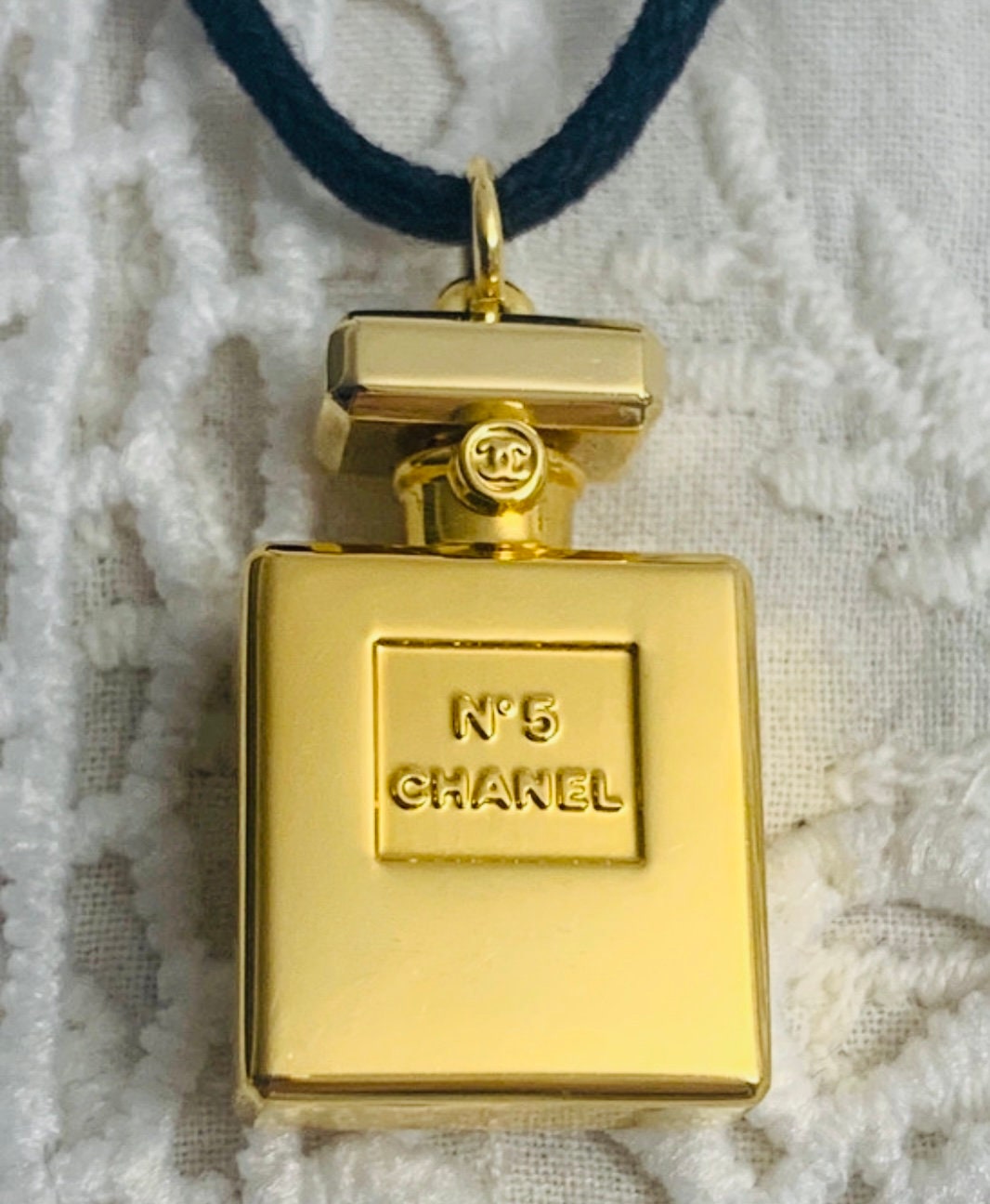 Gold CHANEL Necklace with NO'5 Perfume Pendant.