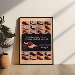 May include: A framed vintage advertisement poster for Foot-Joy golf shoes. The poster features a grid of various two-tone and solid-colored leather golf shoes, with a large central graphic of a brown and white saddle shoe and the text: This is the annual Foot-Joy look-at-a-lot-of-golf-shoes ad.