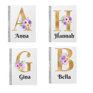 May include: Four spiral bound notebooks with gold foil letters and floral designs. The notebooks are labelled with the names Anna, Hannah, Gina, and Bella.