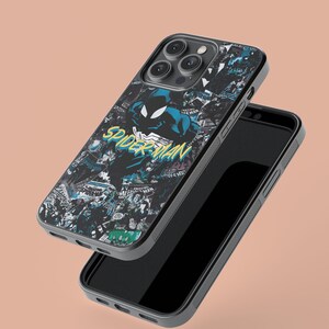 May include: A black phone case with a Spiderman graphic and a collage of comic book panels. The case is designed for an iPhone with a camera bump.