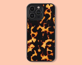 May include: A black phone case with a tortoiseshell pattern. The case has a raised camera bump and a black border.