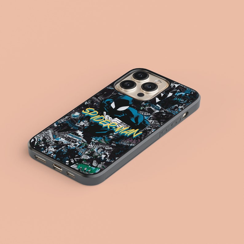 May include: Black phone case with a Spiderman graphic and a collage of comic book panels. The case has a black border and a clear back. The phone case is designed for an iPhone.