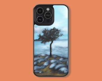 May include: A black phone case with a landscape scene of a lone tree on a rocky shore. The sky is blue and the water is a light blue. The phone case has a camera lens cutout.