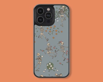 May include: A gray iPhone case with a floral pattern and skeletons. The skeletons are in various poses, some holding flowers. The case has a black border and a camera cutout.