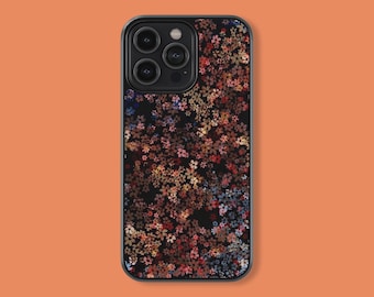 May include: A black phone case with a floral pattern. The flowers are in shades of pink, red, orange, and blue. The case has a cutout for the camera lens.