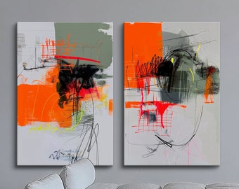 May include: Two abstract paintings with a gray background and orange, red, and black lines and shapes. The paintings are hanging on a gray wall above a gray couch.