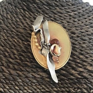 1900s Antique Art Nouveau, Stamped Brass and Sterling Silver Lily Brooch W/ Cabochon Amber Glass, Liquid Silver, bijoux brutalistes