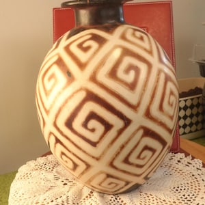 May include: A rustic wooden sign with the text "Welcome to our home" in white lettering. The sign features a distressed finish and a simple, inviting design, perfect for front door decor.