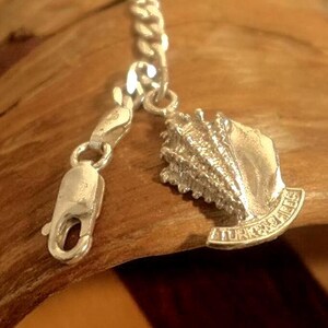 Turks and Caicos 925 Shell Shaped Charm on an Italian 925 Chunky Figaro Chain Bracelet. Made in Italy.