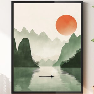 May include: A minimalist digital art print featuring a green mountain landscape with a large orange sun in the sky. The mountains are reflected in a still lake with a small boat in the center.