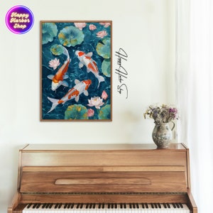 May include: A framed painting of three orange and white koi fish swimming in a blue pond with green lily pads and pink lotus flowers.