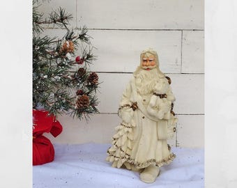 Vintage father Christmas figurine.  Cream and gold Santa Claus statue with tree and toy bag. Large vintage Santa figurine. 9" tall.