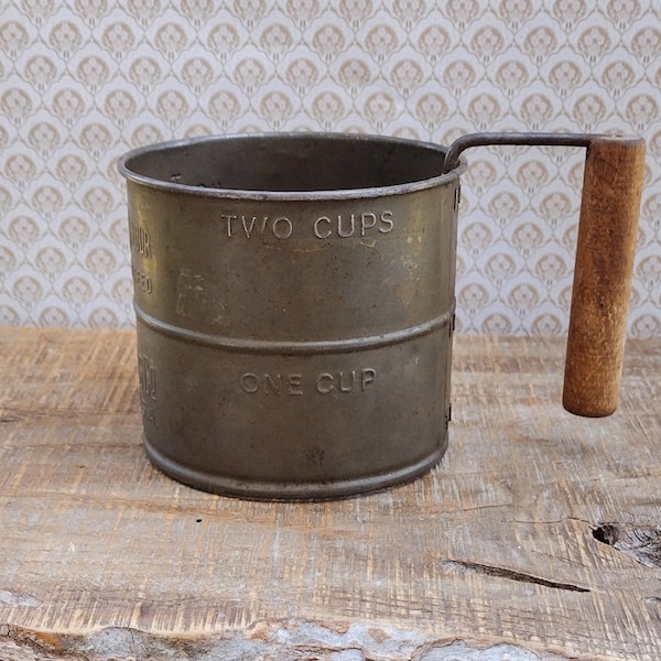 Tiblow Mills Co.  Kansas city. U.S.A. antique flour sifter.  2 c. measuring.  Brown/bronze metal/tin