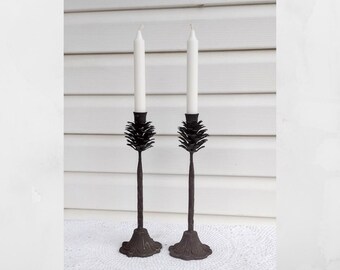 Vintage pair cast iron pinecone design candlestick holders. Rustic candlestick holders.  12" tall.