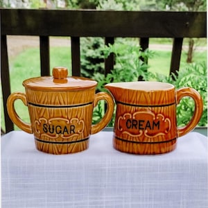 Royal sealy creamer and sugar bowl set. Ceramic wood look barrel style.  Embossed sugar. Royal china.  Vintage 1950s .  2.75&quot; tall
