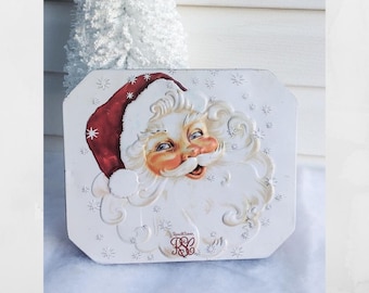Vintage embossed Santa Christmas tin. Hindged lid.  2004 Russell Stovers candy tin.  Christmas cookie tin. Holiday tins.  10" X 8.25" X 1.5"