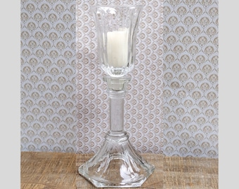 Vintage clear  glass peg votive candle holder. Can be used as a taper candle holder as well.