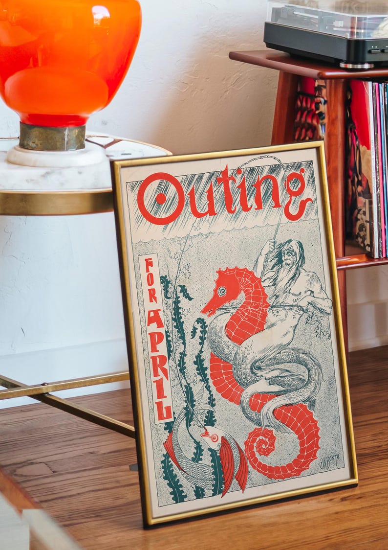 May include: A framed vintage illustration of a seahorse with a man riding it. The illustration is in red, blue, and green colours. The text "Outing for April" is printed in red on the poster.