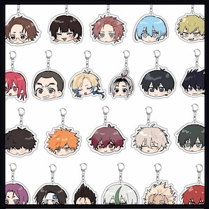 May include: A collection of anime-style character keychains. Each keychain features a different character with unique hair colors and facial expressions. The keychains are attached to silver-colored key rings.