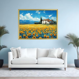 May include: A painting of a white farmhouse with a red roof in a field of yellow sunflowers. The farmhouse is surrounded by a few trees and a blue sky with white clouds. The painting is framed in gold.