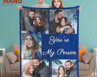 May include: A blue fleece blanket featuring a collage of photographs of a couple. The blanket has the text "You're My Person" in white cursive writing.