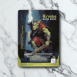 May include: A fantasy card featuring a green goblin warrior named Krenko, the Mob Boss. The card has a red and black color scheme with text describing the creature's abilities and flavor text. The card is 3/3.