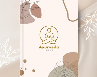 May include: White book cover with a gold outline of a person sitting in a meditative pose. The text "Ayurveda IBIZA" is below the image. The background has abstract shapes and leaves in brown, beige, and gray.