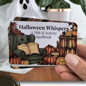 A set of small cards, each beautifully designed with Halloween-themed imagery, and titled: Halloween Whispers- A TBR and Activity Spellbook. In the colors orange, black and brown. The cards offer 27 reading prompts and 6 activities.