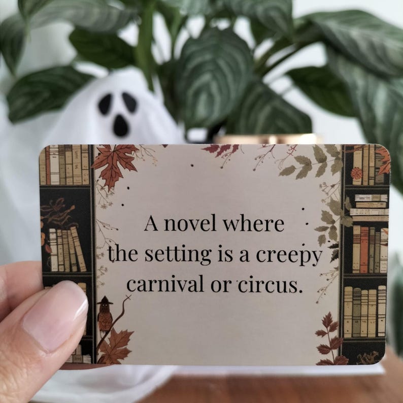 A set of small cards, each beautifully designed with Halloween-themed imagery, and titled: Halloween Whispers- A TBR and Activity Spellbook. In the colors orange, black and brown. The cards offer 27 reading prompts and 6 activities.