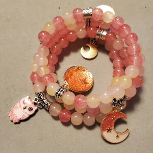 Pink glass bead Bracelet with accent charms