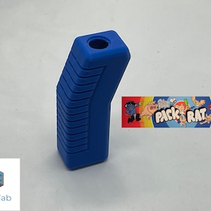 May include: A blue plastic joystick handle with a textured grip and a round hole at the top. The handle is angled and has a rectangular shape. The handle is for a vintage arcade game.
